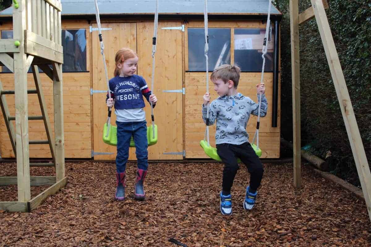 lookout tower wooden climbing frame with swings